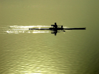A lone sculler on the water - the presence of any person in this photograph does not imply any type of sexual orientation