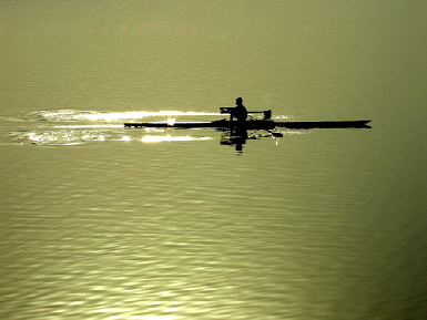 A lone sculler on the water - the presence of any person in this photograph does not imply any type of sexual orientation; photo courtesy of Vivek Bansal